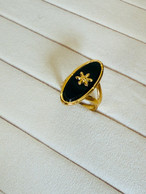 Oval shape statement large charcoal stone studded star emblemed statement ring