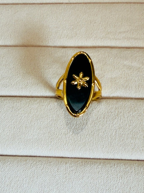 Oval shape statement large charcoal stone studded star emblemed statement ring