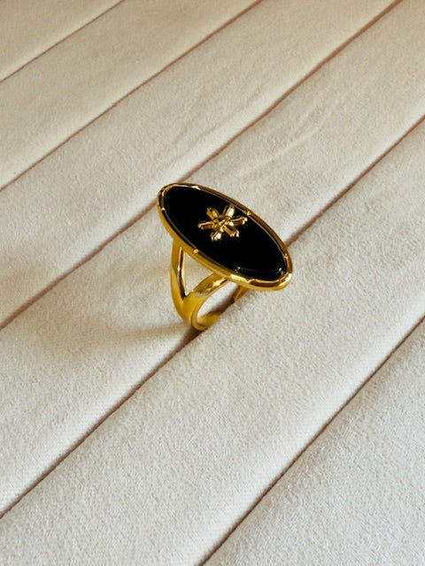 Oval shape statement large charcoal stone studded star emblemed statement ring